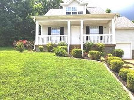 Big front yard and private back yard with deck.