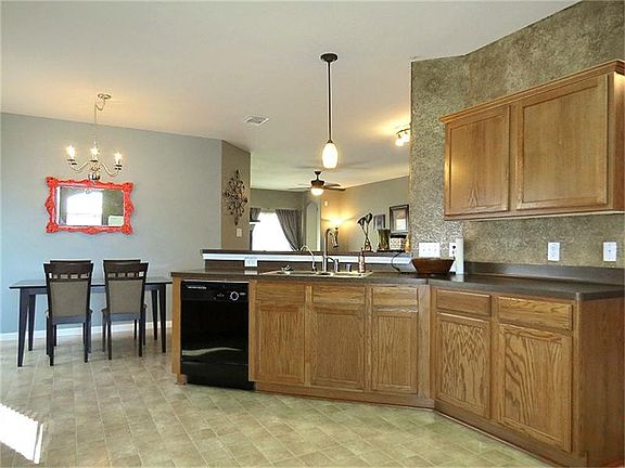 Kitchen is central and opens on to breakfast area and family