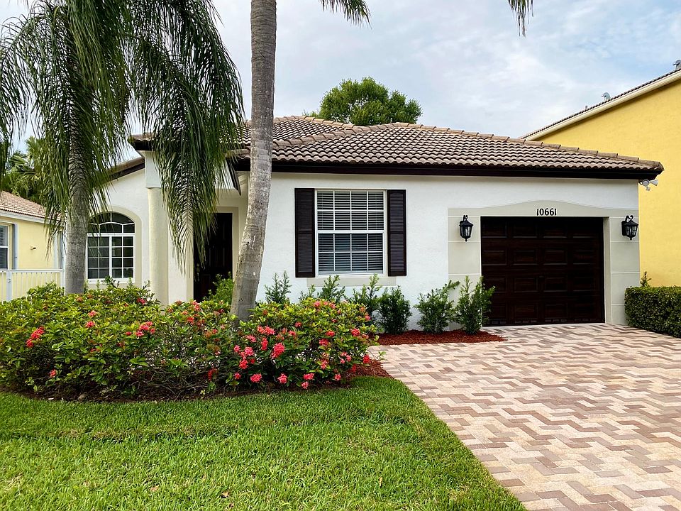 Beautiful landscape and brand new 2-car paver driveway. Garage door and entrance door with new faux finishes. New lighting fixtures throughout.