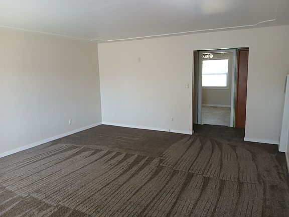 Living room doorway to dining area and hallway