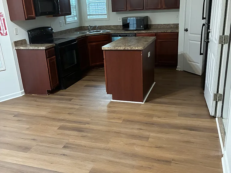 Brand new 7mm LVP flooring kitchen.