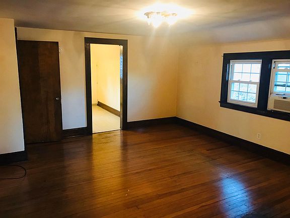 Living area from another angle with Hard wood flor