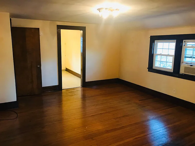 Living area from another angle with Hard wood flor