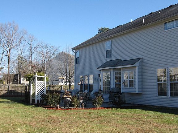 large backyard with stamped concrete patio
