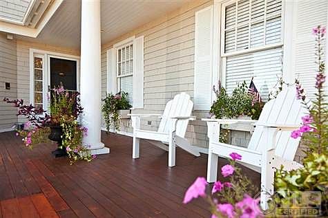 Gorgeous mahogany farmers porch to sit, relax and enjoy the sound of the ocean and unbelievable views
