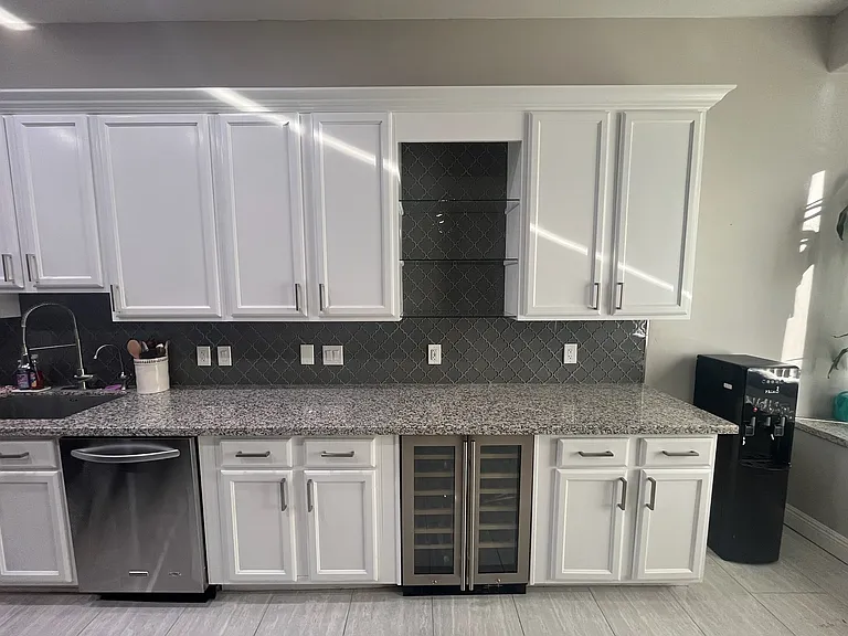 extended cabinets in kitchen with wine fridge