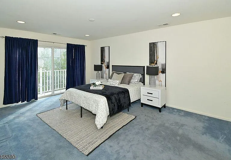 Staged Master Bedroom with Balcony