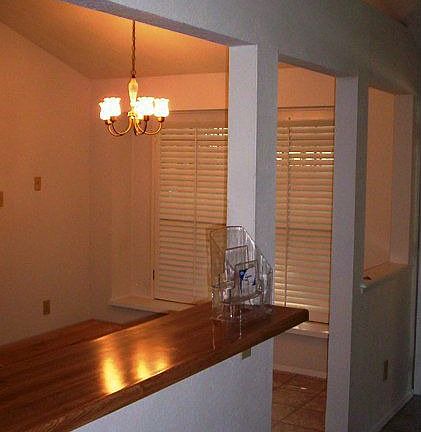 nice dining room with plantation shutters