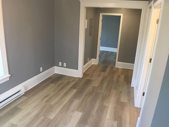 View 2 of Living room looking towards hallway and door to bedroom 1