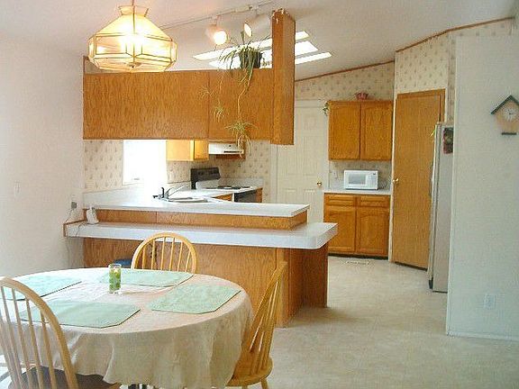 dining area into the kitchen