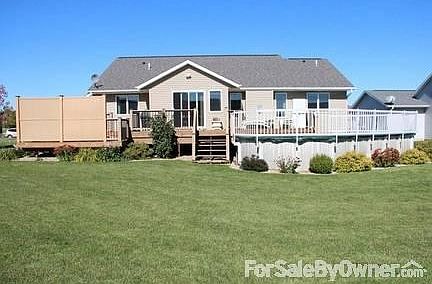 Front Yard
						:
						Blue Spruce with complimentary shrubs and flowers.
