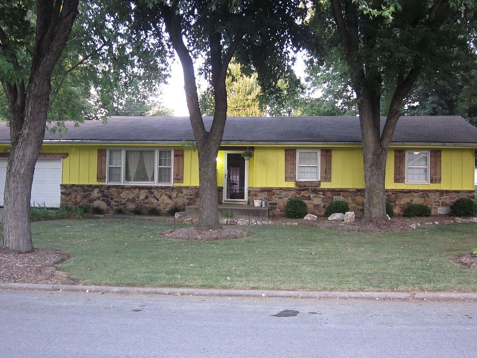 Front view from street.  4 large silver maples in front yard.