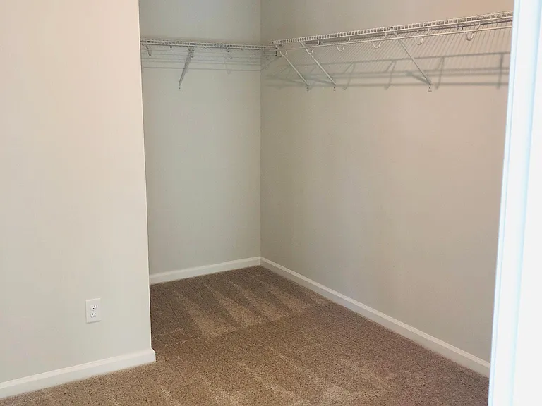 Huge walk in master closet. Not shown are 2 more hanging racks.