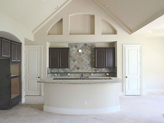 GLASS & STONE ACCENT TILE INTHE ISLAND KITCHEN