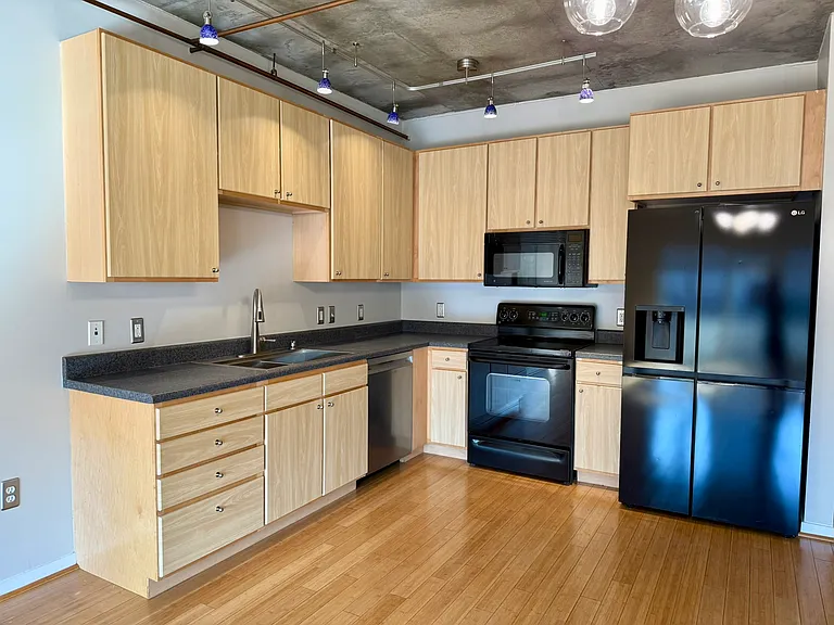 Kitchen with new fridge and dishwasher