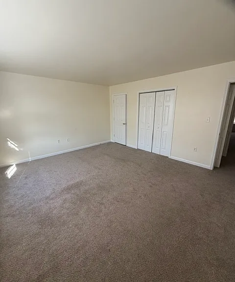 Bedroom 1 with double window and closet