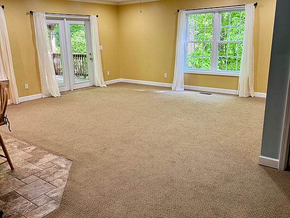 Large windows with curtains. Keep them or furnish with your own.