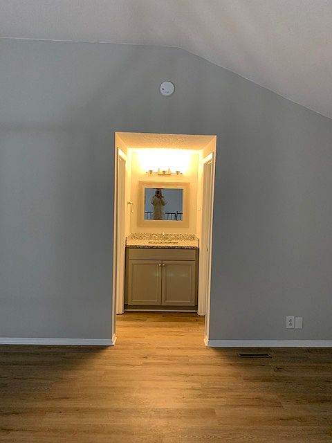 Loft bedroom vanity. Walk-in closet on left and bathroom on right.