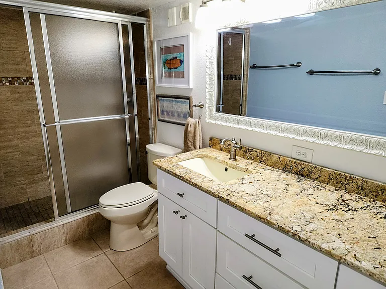 Pebble Beach Granite countertops in downstiars bathrooms