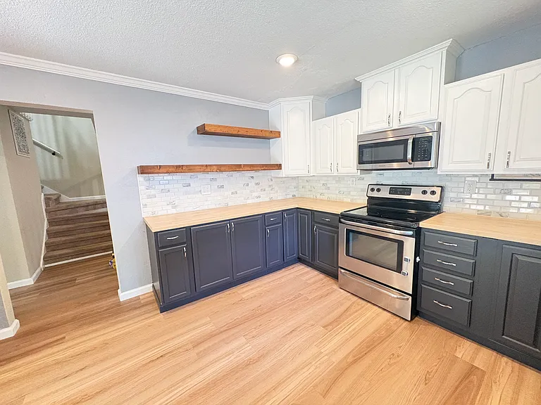 This thoughtfully designed, spacious kitchen makes cooking a pleasure, with ample room to add a kitchen cart of your own, allowing the space to reflect your family's style and needs.