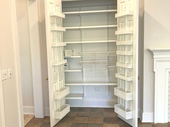 This kitchen pantry provides additional storage and is convenient to work space in kitchen. Located 