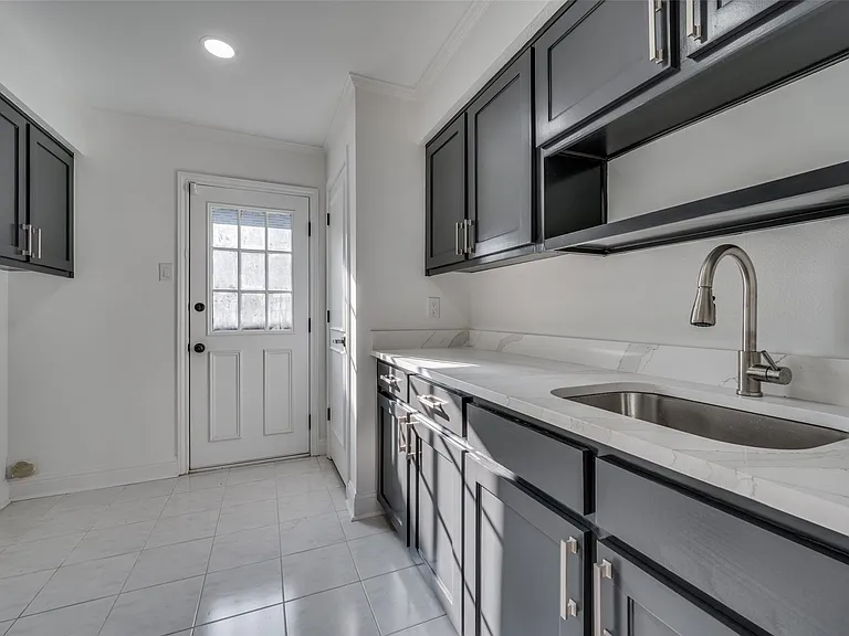 Utility room with sink and room for 2nd refrigerator