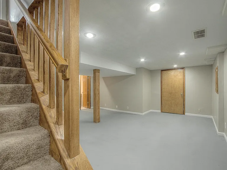 Downstairs offers space for a play room, a man-cave, and more !