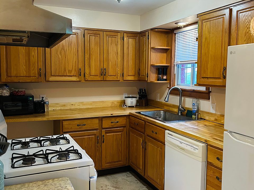 Kitchen with gas range, dishwasher, new refrigerator. Upgrades in cabinets.