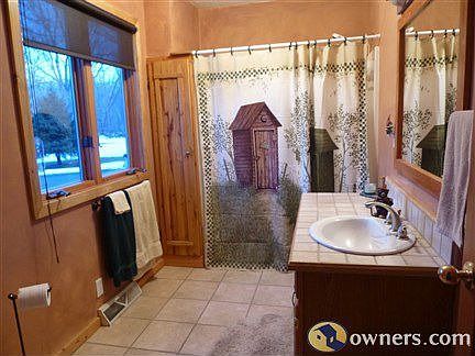 Main floor bathroom with ceramic tile floor