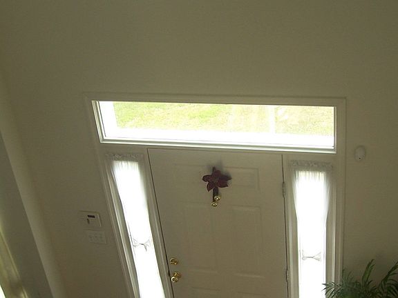 Two story foyer with gleaming hardwood floors!