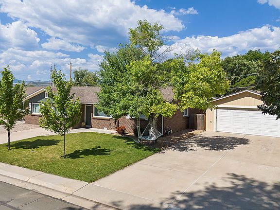 Looking west with unit and detached garage pictured
