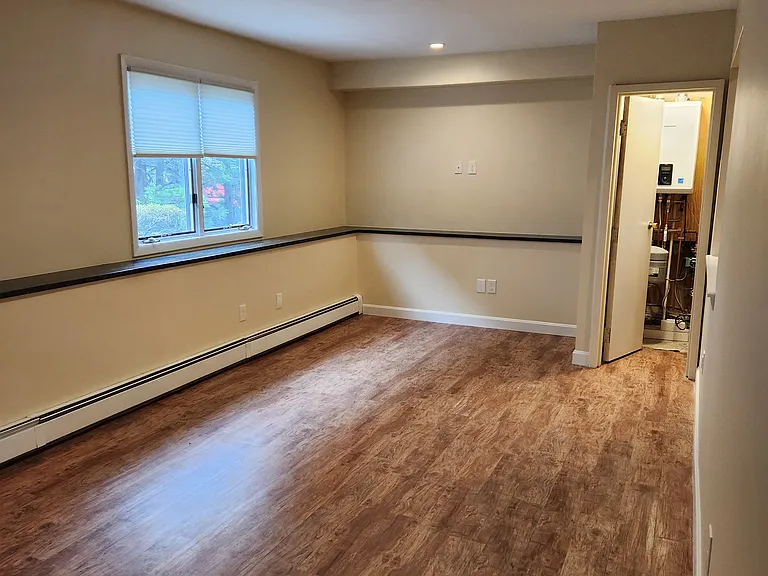Looking at Living Room w/ recess dimming LED light and Mechanical Room Closet
