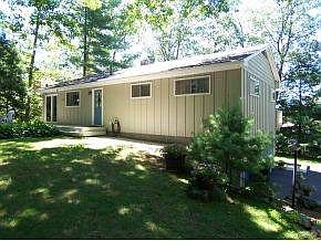Shaded rear yard with deck