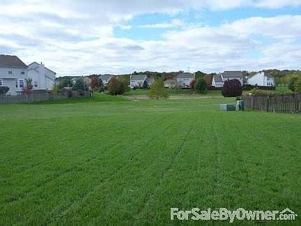 BACK YARD VIEW WITH EASEMENT
						:
						backyard, easement goes to lake(pond)