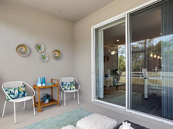 Your interior opens to outdoor living space on a screened lanai.