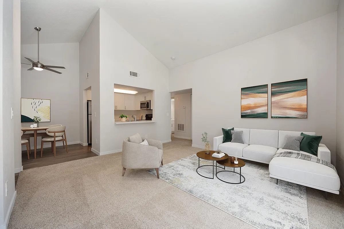 Living room with vaulted ceilings - Rush River Apartments