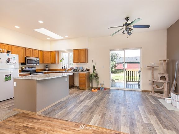 large dinning area with access to backyard with surrounding mountain views