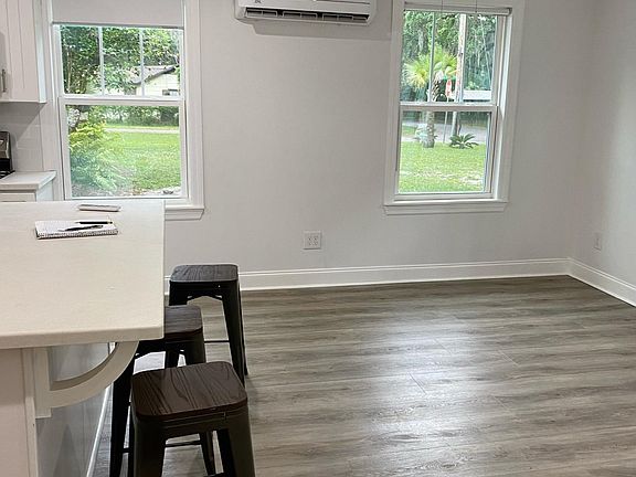 The Living room- all the rooms have roll up shades in white.