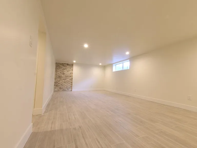 Basement living area looking towards front of home.