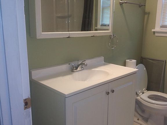 Bathroom - marble tile floor -new vanity, sink, and surround (visible in mirror)