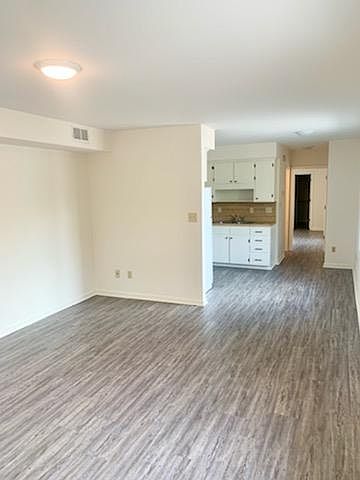 Coming in front door into the living room.