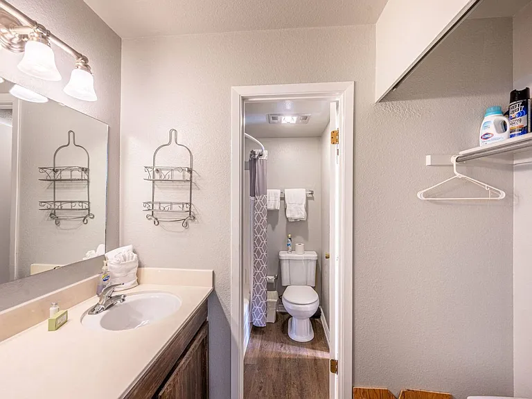Second vanity with view of the "Jack and Jill" style toilet and tub/shower