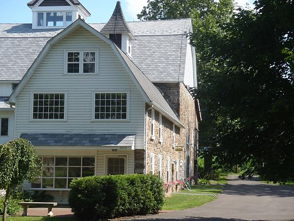 North exterior w/patio & living room door