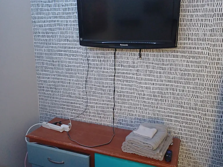 Wall mounted t v with dresser and remote