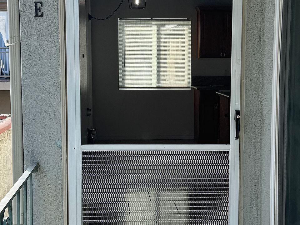 Screened front door to the apartment.