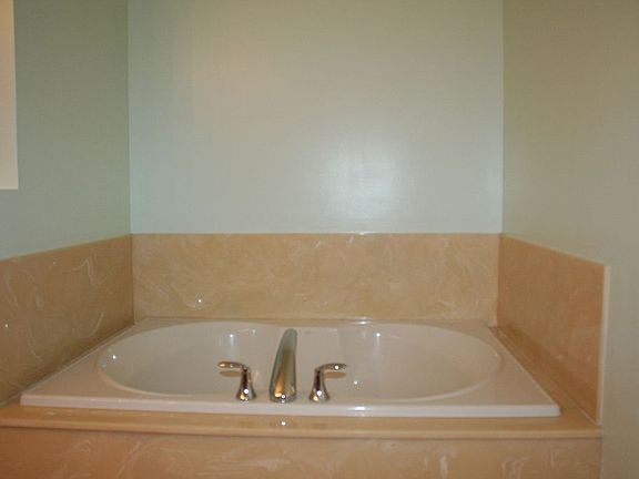 Two extra-large soaker bath tubs