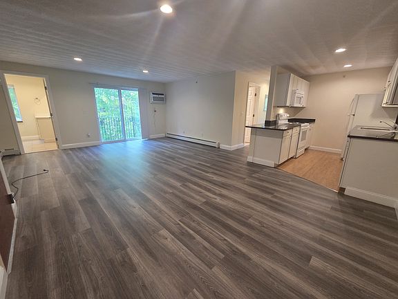 Large open, sun filled rooms, new laminate flooring, balcony, separate 1/2 bath