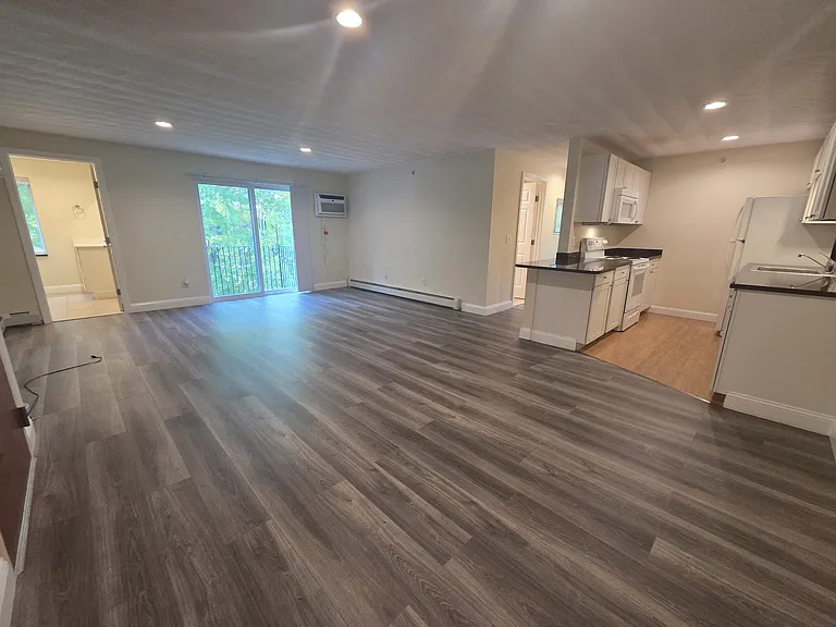 Large open, sun filled rooms, new laminate flooring, balcony, separate 1/2 bath