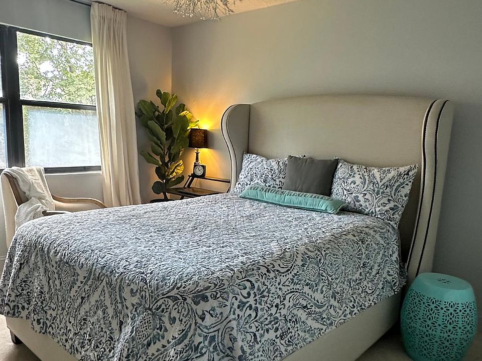 The master bedroom windows face east with a view of the fenced-in backyard. The room is quiet and separated from the rest of the house. The room is carpeted with a queen-sized bed.
