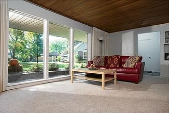Additional view of the Living Room as looking toward the front entry Foyer with tile flooring and large front closet.